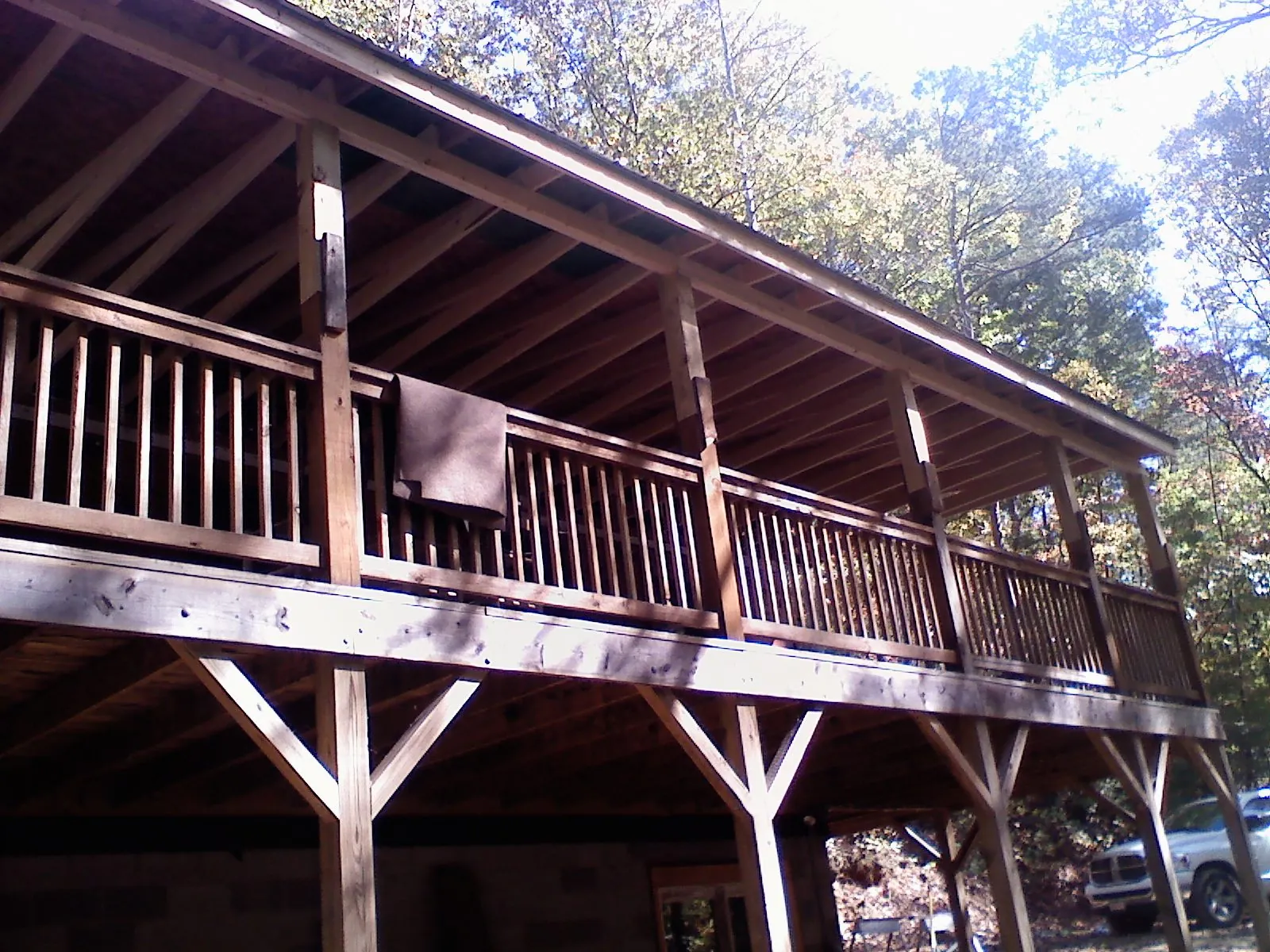 Timber framing under a new elevated porch and deck — Roof Leak Repair in North Palm Springs by Roofing Brothers